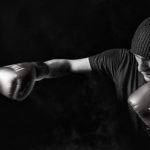 violence 1 A black and white photo of a boxer punching