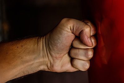 Clenched Fist Punching a Wall